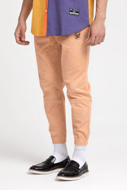 Peach twill jogger pants for both men and women