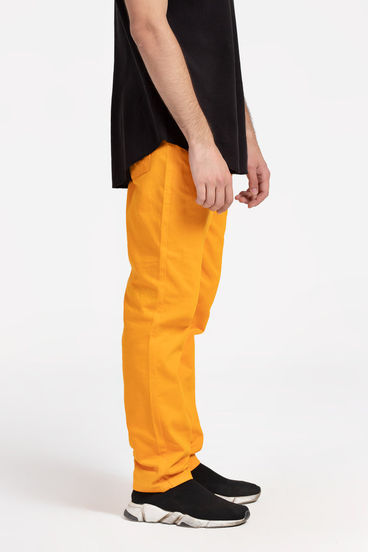 Yellow color over dyed unisex denim pants