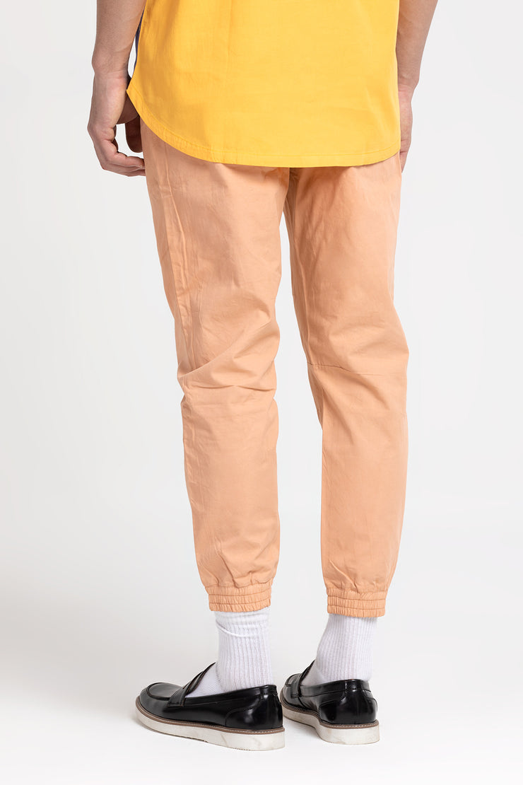 Peach twill jogger pants for both men and women