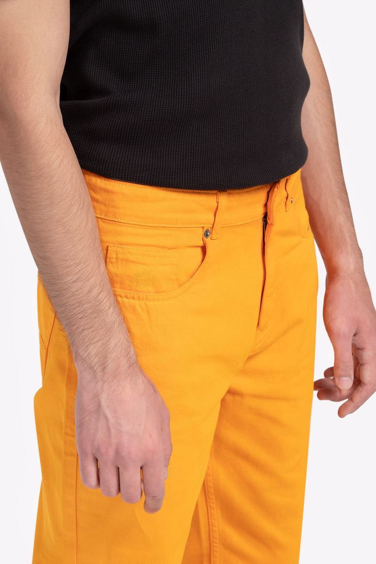 Yellow color over dyed unisex denim pants