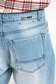 Damaged or ripped denim pants for both men and women