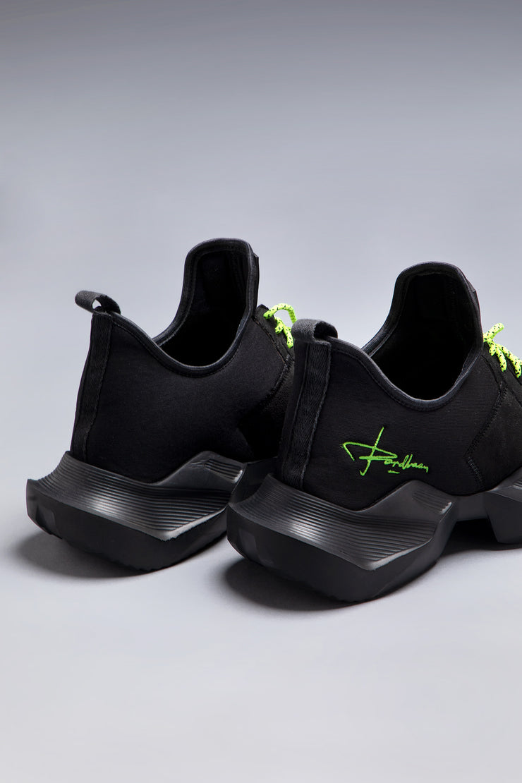 Black edgy casual shoes with neon laces